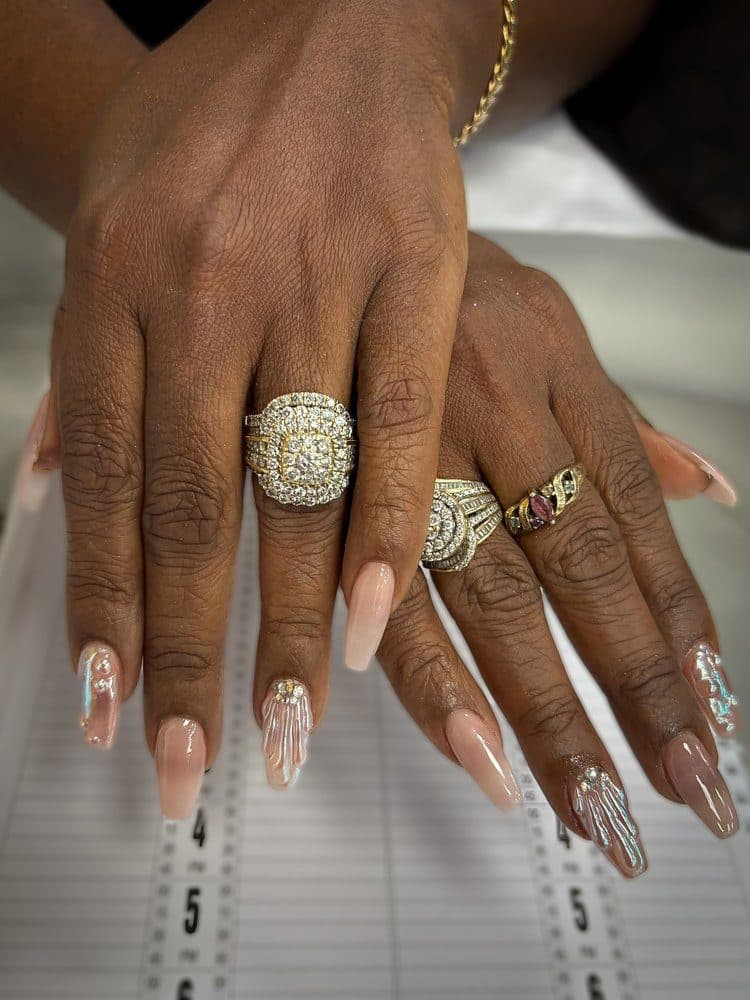 Long nude coffin nails with iridescent crystal accents