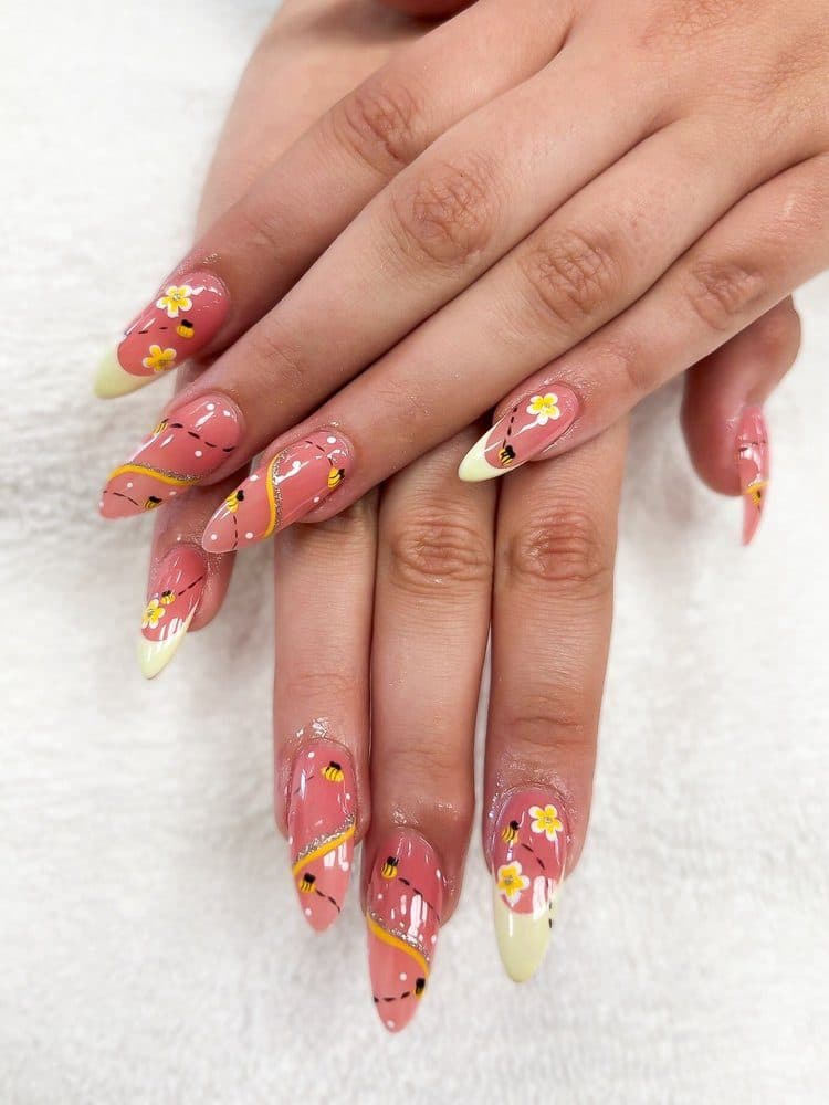 Almond nails with bees, daisies and yellow french tips